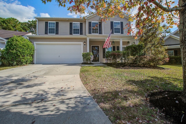 view of front of house featuring a front yard and a garage