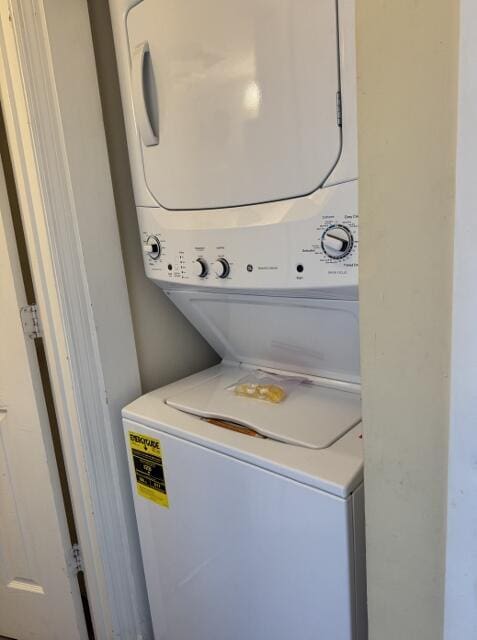 washroom with stacked washer and dryer