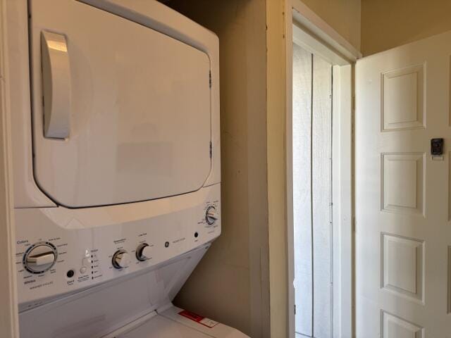 laundry room featuring stacked washer / dryer