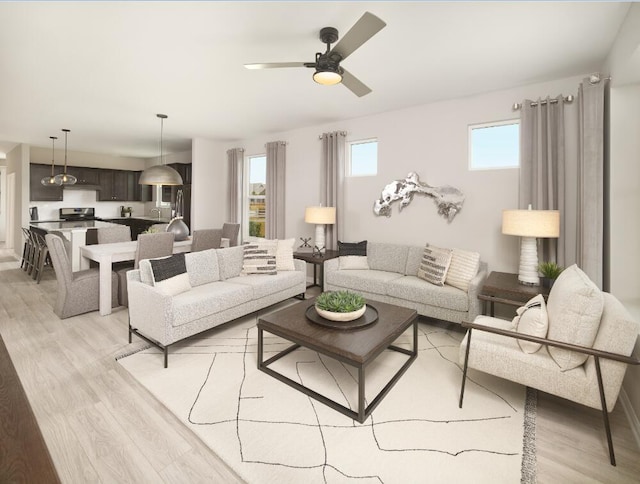 living room featuring ceiling fan and light wood-type flooring