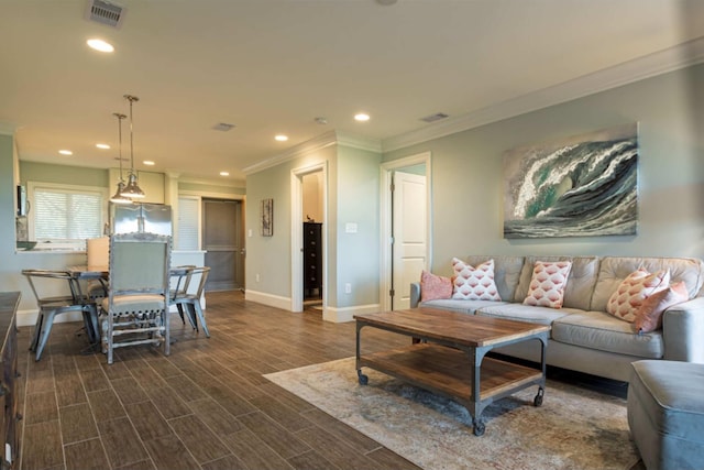 living room featuring dark hardwood / wood-style floors and ornamental molding