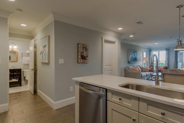 kitchen with stainless steel dishwasher, decorative light fixtures, ornamental molding, sink, and light stone counters