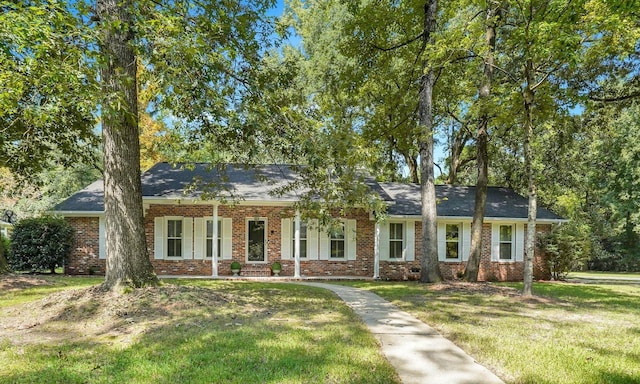 ranch-style house featuring a front lawn