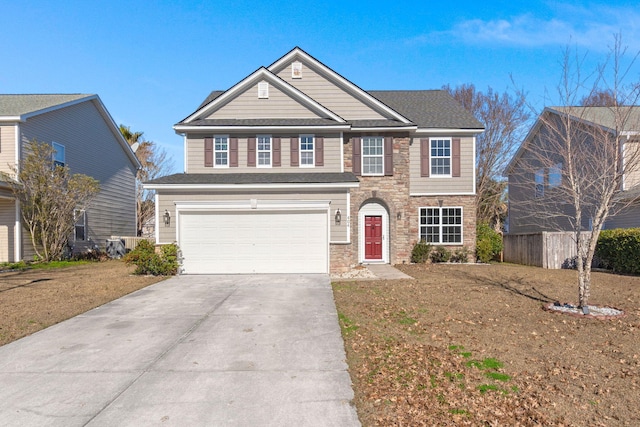 view of front of property with a garage and a front lawn