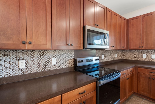 kitchen with backsplash and stainless steel appliances