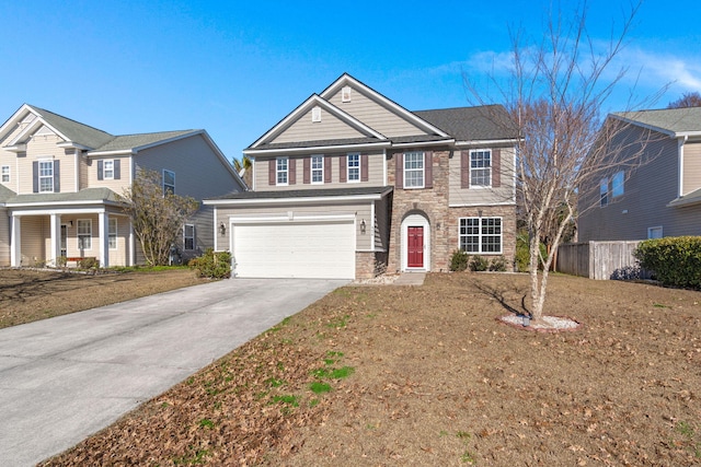 view of front of house featuring a front lawn and a garage