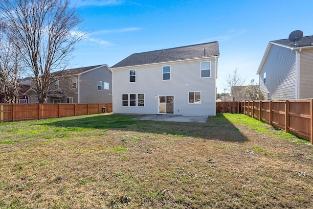 rear view of property with a patio area and a yard