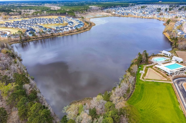 birds eye view of property with a water view