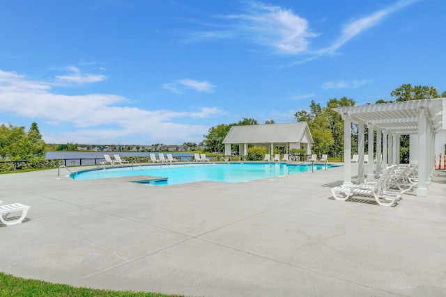 view of pool with a pergola and a patio area