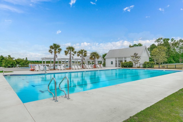 view of swimming pool with a patio