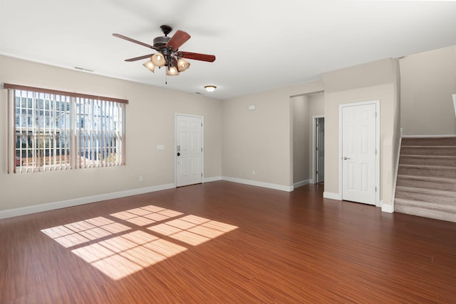 empty room with dark hardwood / wood-style floors and ceiling fan