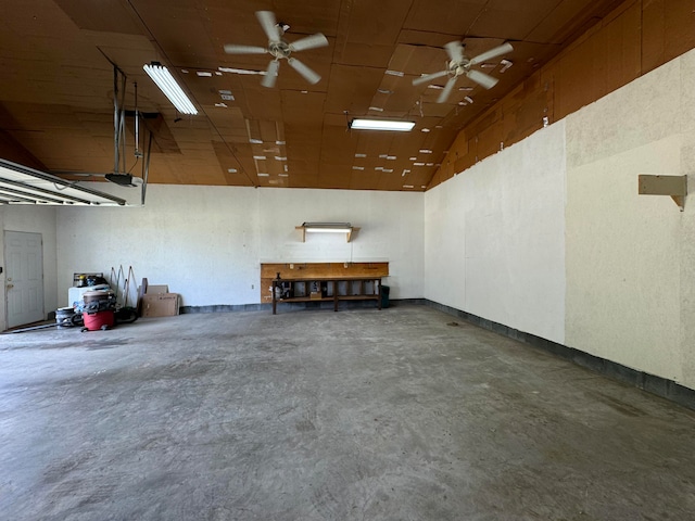 garage featuring ceiling fan and a garage door opener