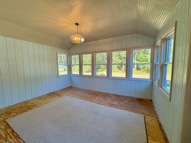 unfurnished sunroom with a notable chandelier and lofted ceiling