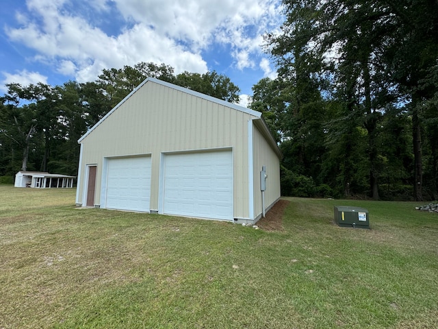 garage with a yard