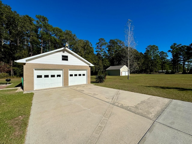 garage with a yard