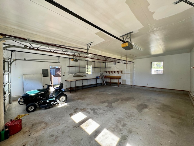 garage featuring a garage door opener and electric panel