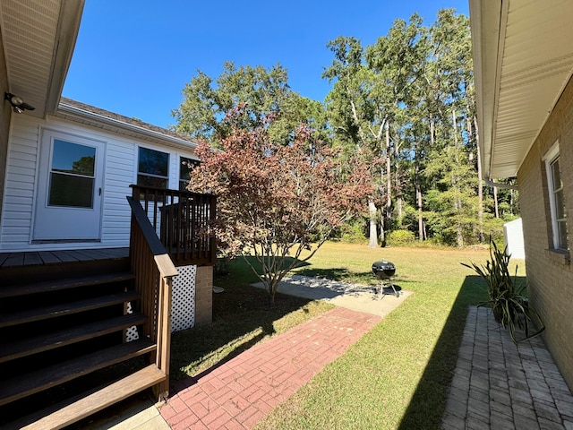 view of yard featuring a wooden deck