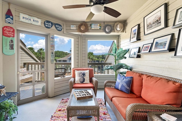 sunroom / solarium featuring ceiling fan