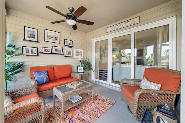 sunroom / solarium featuring ceiling fan