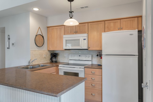 kitchen with decorative backsplash, white appliances, sink, kitchen peninsula, and decorative light fixtures