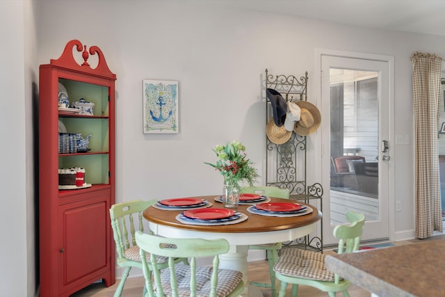 dining space featuring hardwood / wood-style flooring