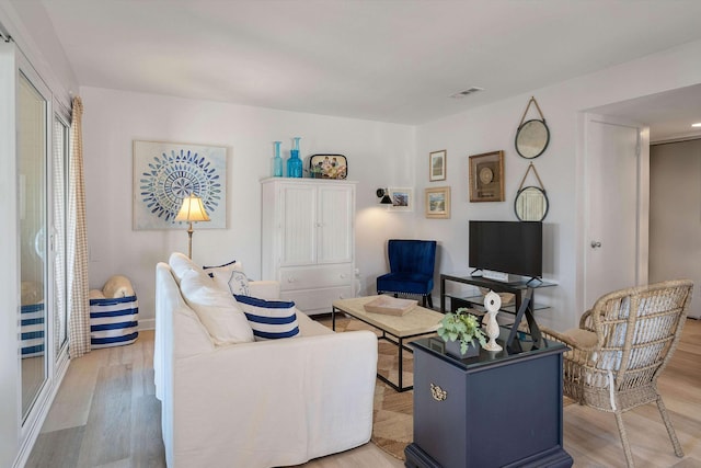 living room with light hardwood / wood-style floors