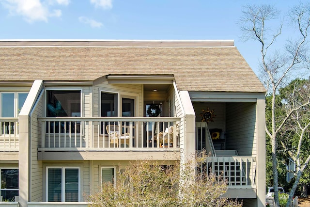 rear view of property with a balcony