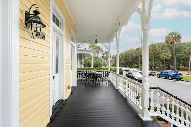 wooden terrace with a porch