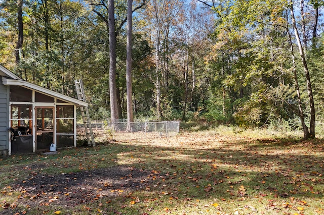 view of yard with a sunroom