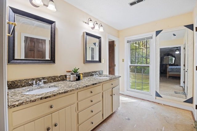 bathroom with double sink and vanity with extensive cabinet space