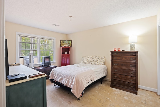 bedroom featuring a textured ceiling