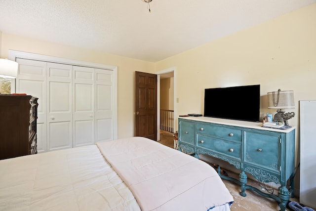 bedroom featuring a closet and a textured ceiling