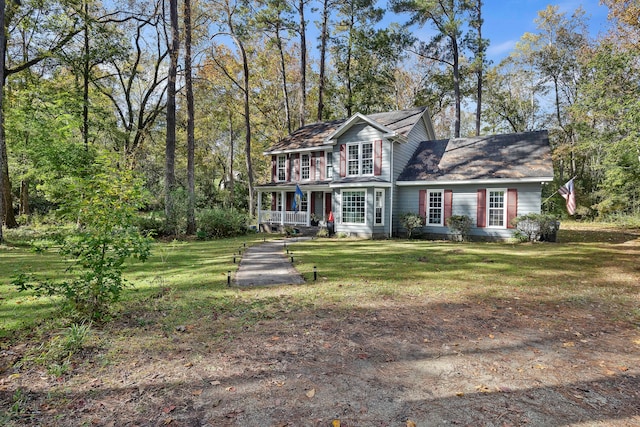 view of front facade featuring a front lawn and a porch