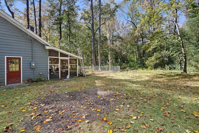 view of yard featuring a sunroom