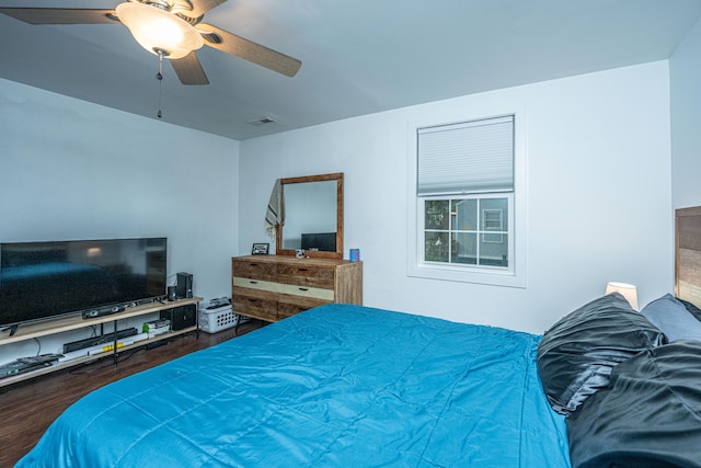 bedroom featuring ceiling fan and hardwood / wood-style flooring