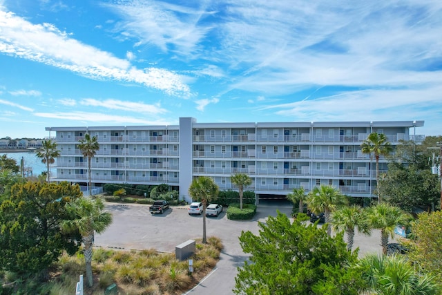 view of property with uncovered parking