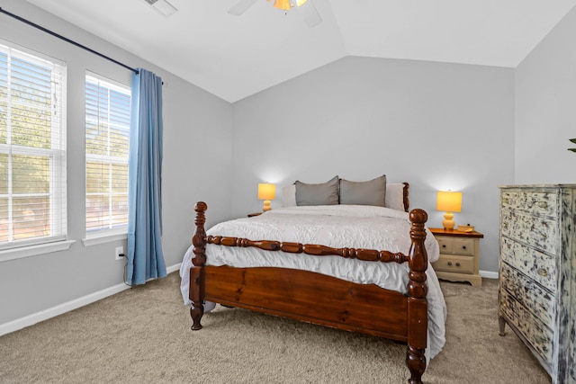 carpeted bedroom with vaulted ceiling and ceiling fan