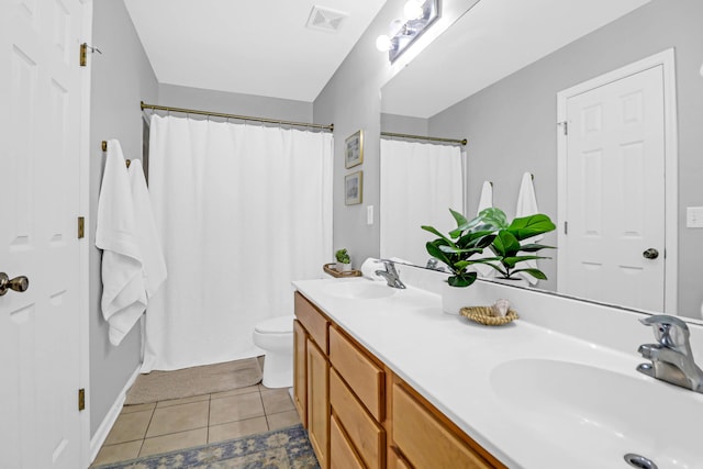 bathroom featuring tile patterned flooring, vanity, toilet, and a shower with shower curtain