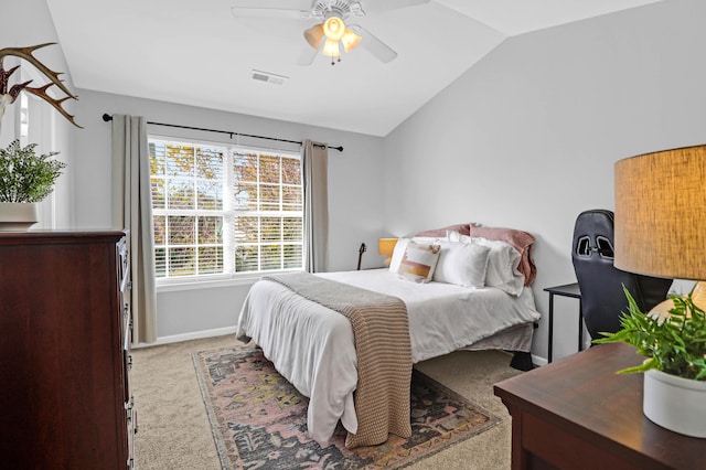 bedroom featuring ceiling fan, light colored carpet, and lofted ceiling