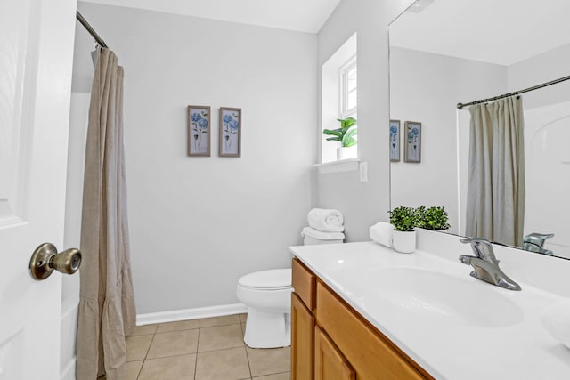 full bathroom with tile patterned flooring, shower / bath combination with curtain, vanity, and toilet