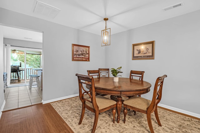 dining room with light wood-type flooring