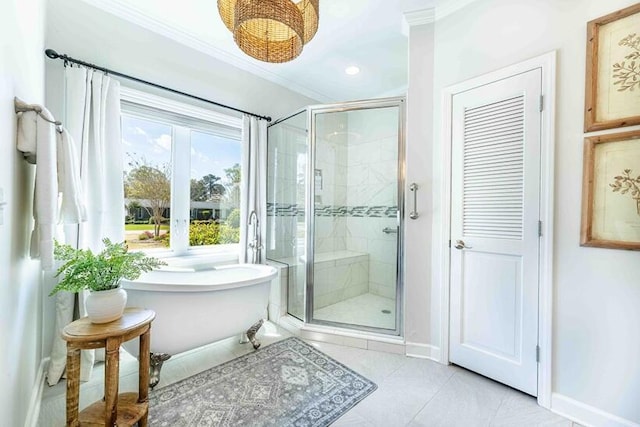 full bathroom featuring a shower stall, baseboards, a soaking tub, and crown molding