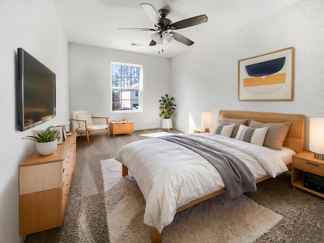 carpeted bedroom with a ceiling fan