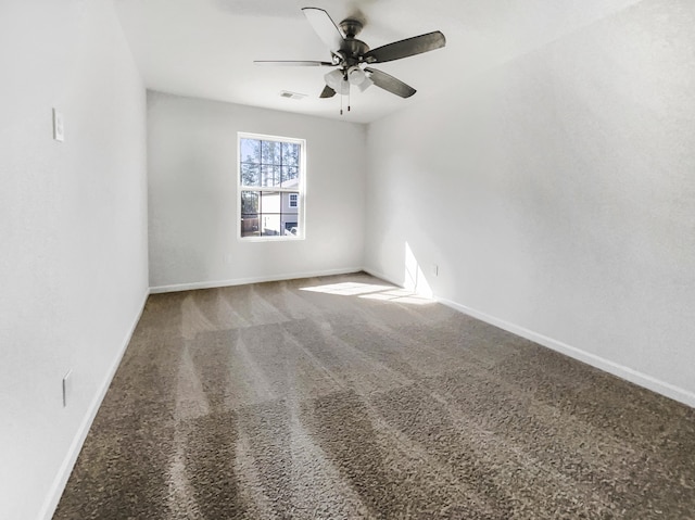 unfurnished room featuring carpet floors, baseboards, and a ceiling fan