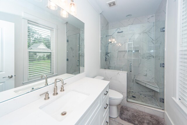 bathroom featuring tile patterned floors, walk in shower, toilet, and vanity