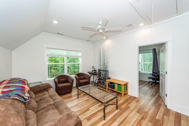 living room featuring lofted ceiling, light hardwood / wood-style flooring, ceiling fan, and ornamental molding