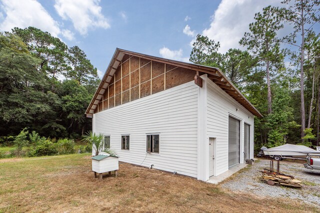 view of property exterior with a yard