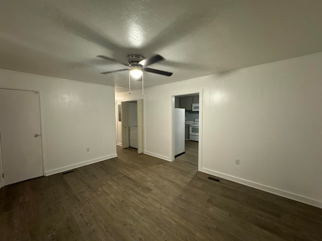 unfurnished bedroom featuring ceiling fan, dark hardwood / wood-style floors, and white refrigerator