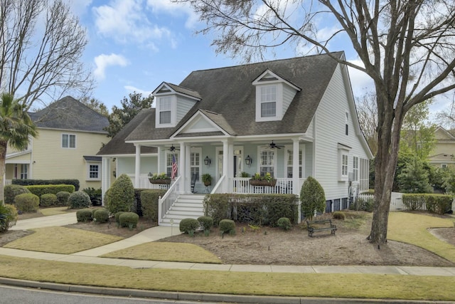 cape cod home featuring ceiling fan, a porch, and roof with shingles