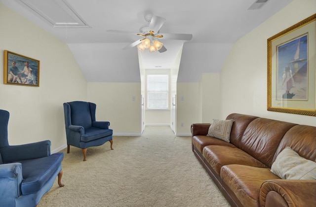 living area featuring attic access, visible vents, baseboards, lofted ceiling, and carpet floors